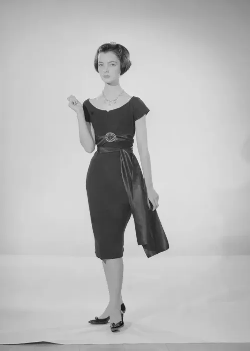 Framed Print : Model Jennifer Goddard. Young woman in short dressy black dress