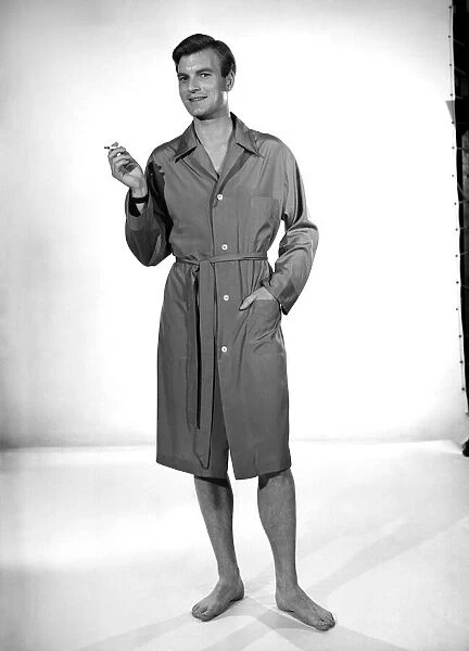 Model Jeremy Dempster wearing a sleeping coat. 1957