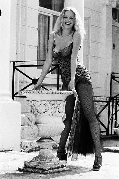 Model Jo Howard wearing the original costume worn by Marilyn Monroe in the film