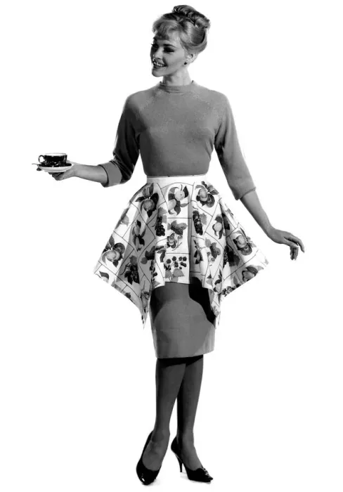 Framed Print : Model Jo Waning wearing knee length dress with floral patterned wrap around the waist Framed Print : Model Jo Waning wearing knee length dress with floral patterned wrap around the waist