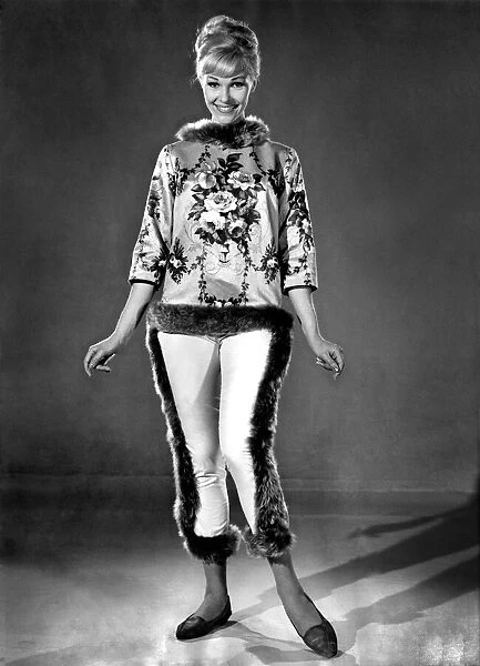 Model Jo Waring shows off a floral patterned silk top with fur lined trousers