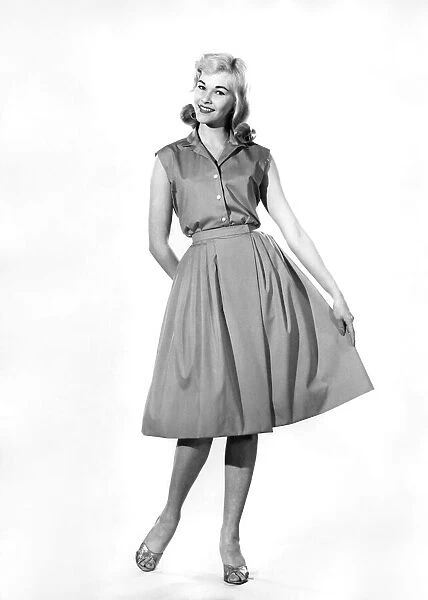 Model Jo Waring wearing a sleveless three quarter length evening dress