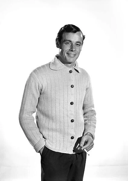 Model John Handy wearing cardigan in Reveille Studio. 1960