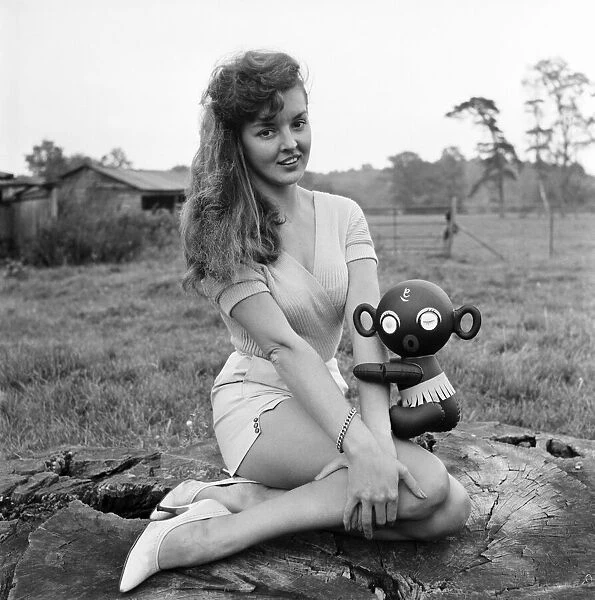 Model Kim Pearson seen here with inflatable alien toys. 1962 E422