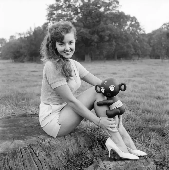 Framed Print : Model Kim Pearson seen here with inflatable alien toys. 1962 E422-005 Framed Print : Model Kim Pearson seen here with inflatable alien toys. 1962 E422-005