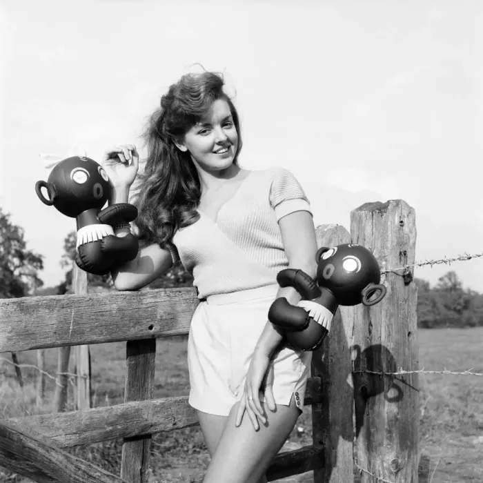 Framed Print : Model Kim Pearson seen here with inflatable alien toys. 1962 E422-004 Framed Print : Model Kim Pearson seen here with inflatable alien toys. 1962 E422-004
