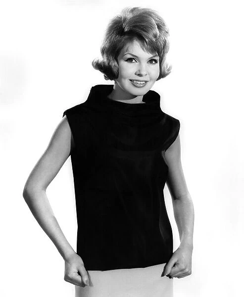 Model Liz Duke wearing sleveeless top with polo neck. February 1962 P008888