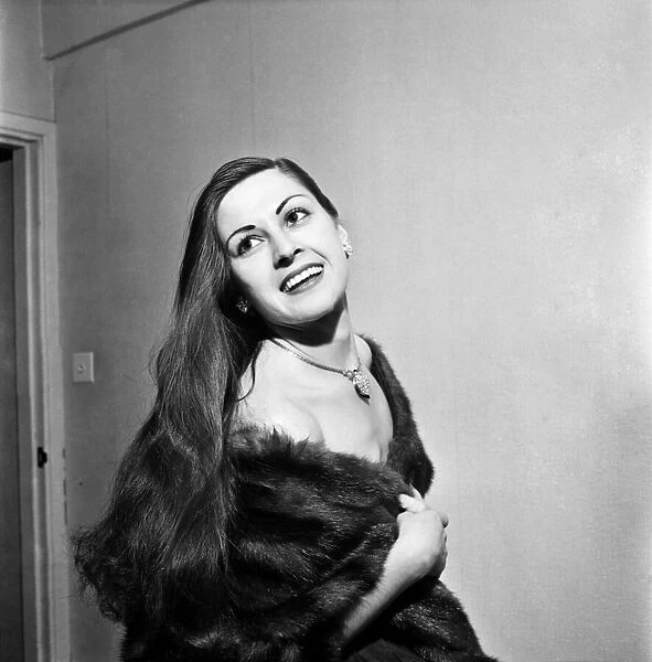 Model with Long Hair and wearing a fur coat. December 1952 C6259