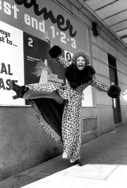 Model Lorne Lesley wearing a long leopard skin coat with fur collar February 1975