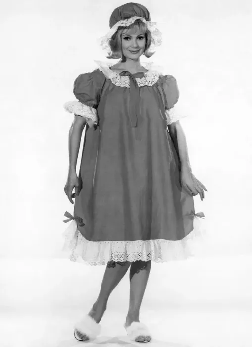 Framed Print : Model Margaret London wearing a long baggy style night dress with frilly trims Framed Print : Model Margaret London wearing a long baggy style night dress with frilly trims