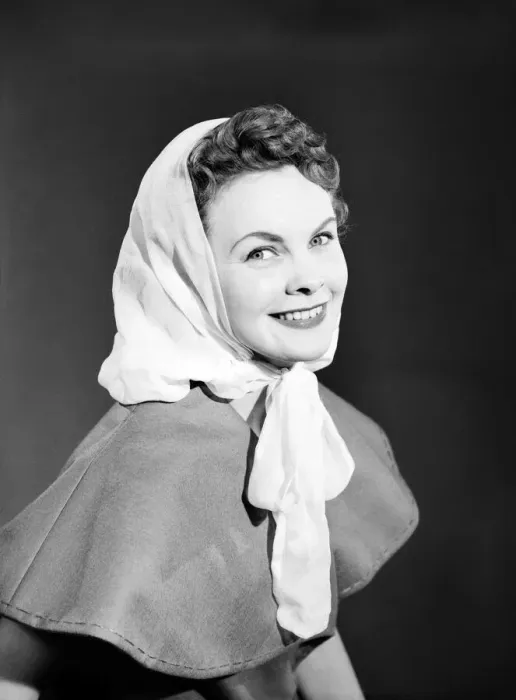 Framed Print : Model Maureen Denham putting on head scarf. July 1956 Framed Print : Model Maureen Denham putting on head scarf. July 1956