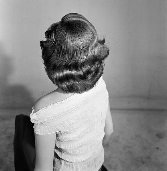 Model Pam Felstead, who is modelling hairstyles for the Daily Mirror. 18th June 1957
