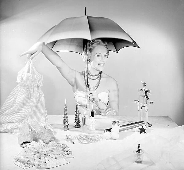 Model Patti Morgan with the must have decorations and gifts for Christmas 1954