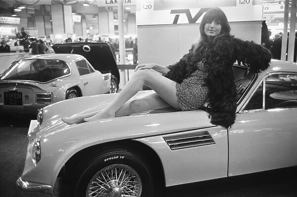Model poses on the bonnet of a TVR at the Motor Show 15th October 1968