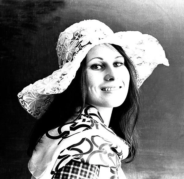 A model posing with a floppy hat in April 1971