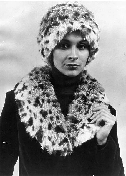 A model posing in the latest fake fur hat and scarf