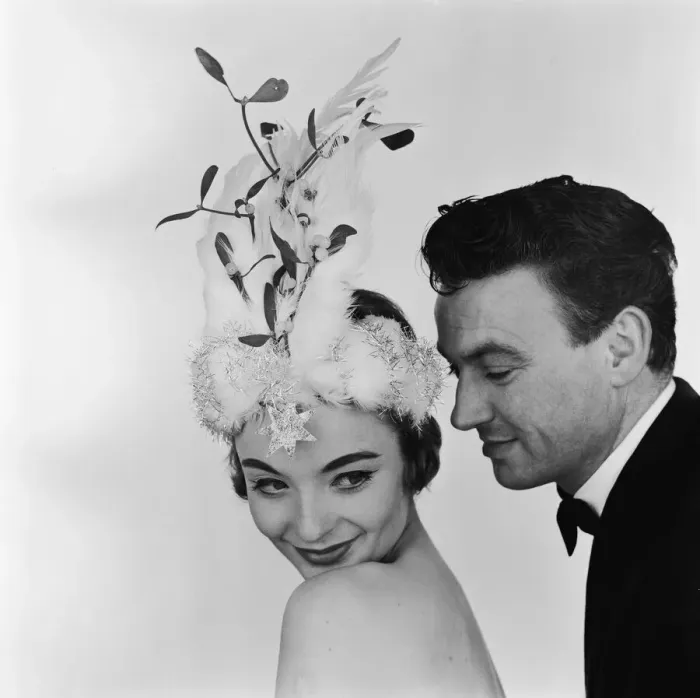 Framed Print : A model posing in the studio, wearing a Christmas bonnet designed by Madge Ehard