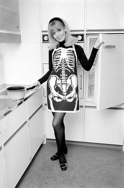 Model posing wearing a skeleton pinafore. December 1969 Z11686-006