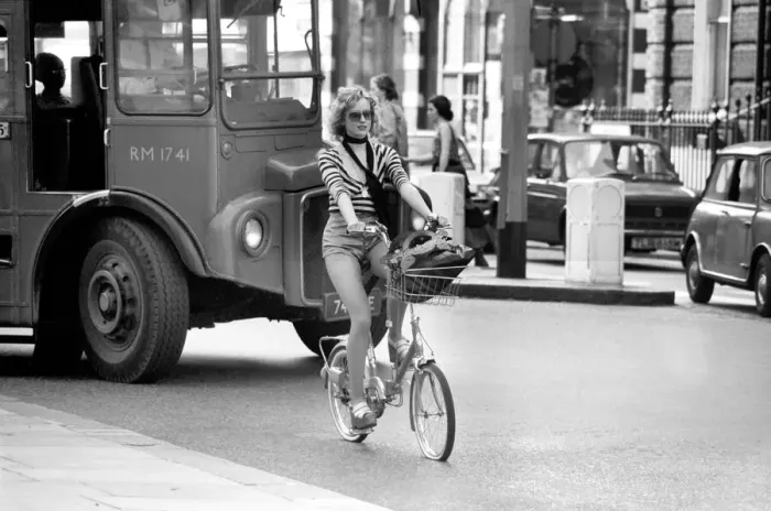 Framed Print : Model riding a bicycle in Kings Road Chelsea, London. April 1975 75-2156-009 Framed Print : Model riding a bicycle in Kings Road Chelsea, London. April 1975 75-2156-009