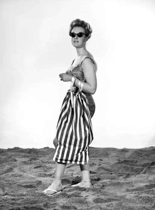 Framed Print : Model Roma Reeves wearing beach toga that doubles as a beach towel. May 1962 Framed Print : Model Roma Reeves wearing beach toga that doubles as a beach towel. May 1962