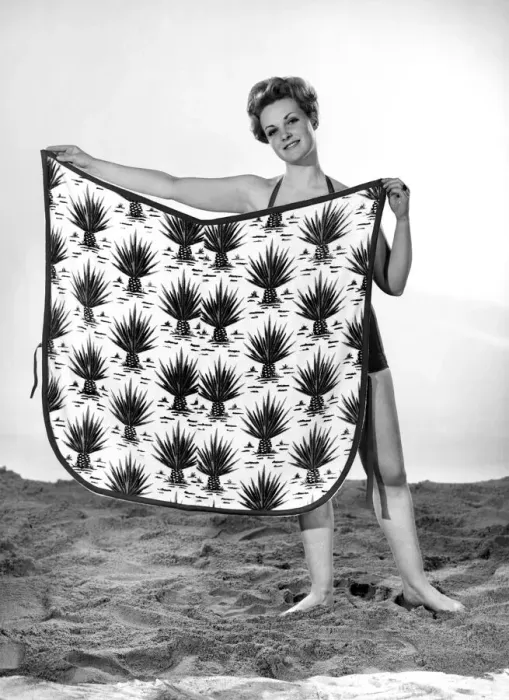 Framed Print : Model Roma Reeves wearing beach toga that doubles as a beach towel. May 1962 Framed Print : Model Roma Reeves wearing beach toga that doubles as a beach towel. May 1962