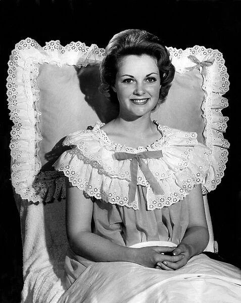 Model Roma Reeves wearing dress with frilly top and bow. August 1961 P008744