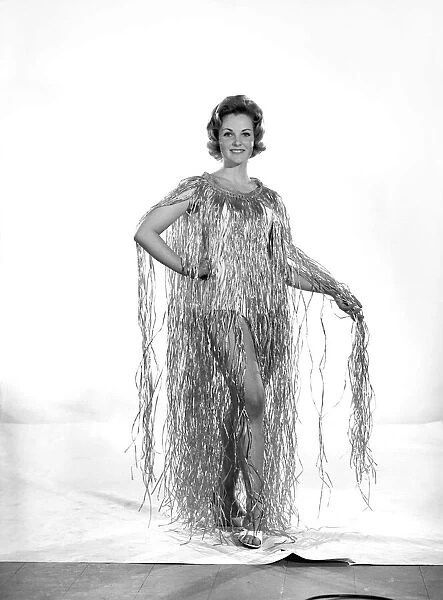 Model Roma Reeves wearing grass dress. Circa 1963