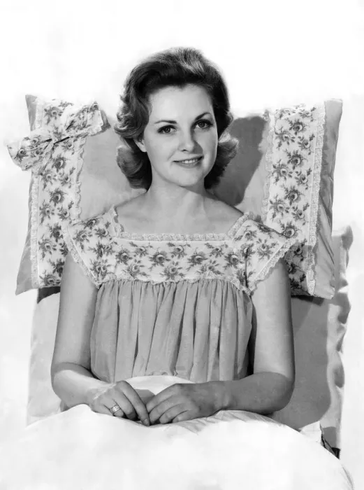 Framed Print : Model Roma Reeves wearing nightdress sitting up on the bed. August 1961 P008745