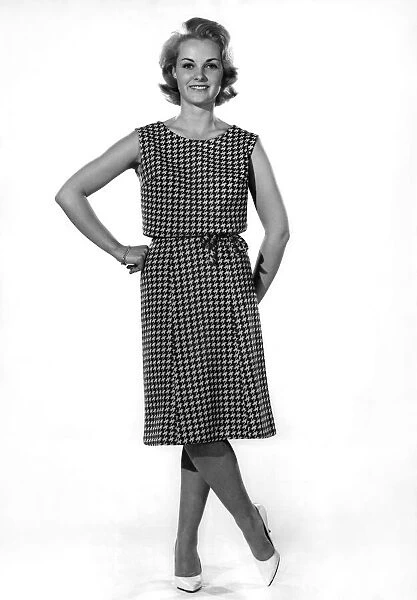 Model Roma Reeves wears a sleeveless patterned long dress. October 1961 P008781
