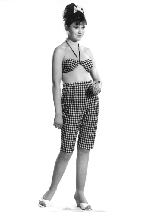 Framed Print : Model Rosemary Bill wearing checkered long shorts and matching top
