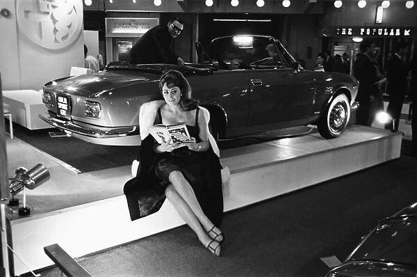 Model sits beside a Sprint CTC at the British International Motor Show in London 19th