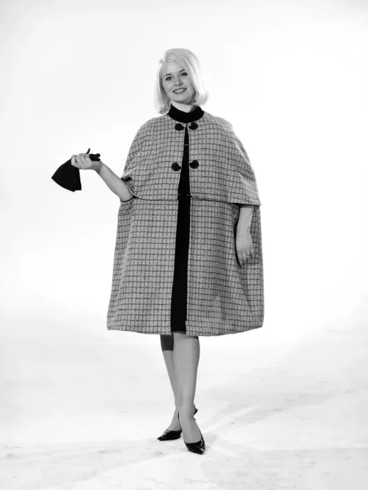 Framed Print : Model Vyvyan Dunbar wearing check cape which can be worn either full length or quarter