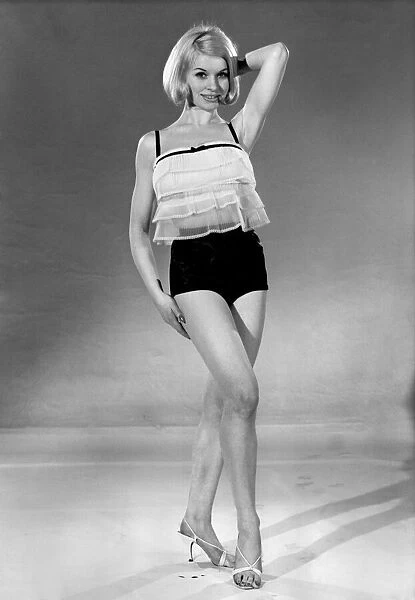 Model Vyvyan Dunbar wearing see through lace top with back shorts. July 1965
