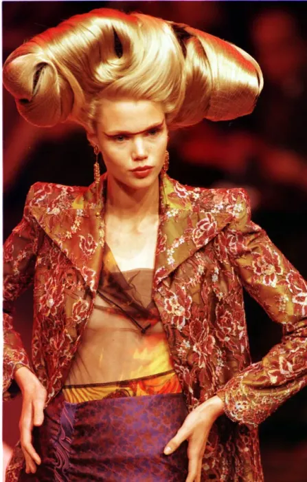 Framed Print : A model walking down the catwalk October 1997 showing Christian Lacrioxs latest designs