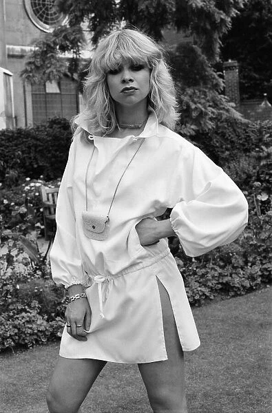 Model wearing 1977 clothing, Sunday Mirror fashion feature, pictured in garden