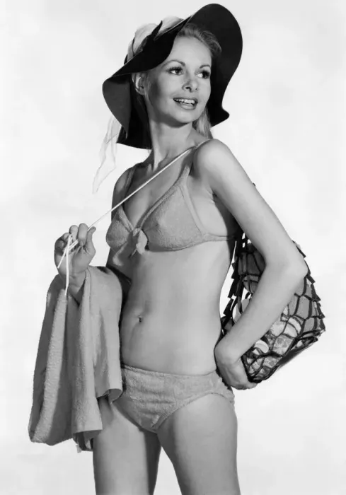 Framed Print : Model wearing a bikini. and hat, carrying a bag over her shoulder August 1970 Framed Print : Model wearing a bikini. and hat, carrying a bag over her shoulder August 1970