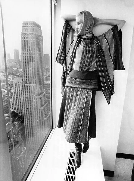 Model wearing a clutch cargo-striped wool, Mohair and silk skirt