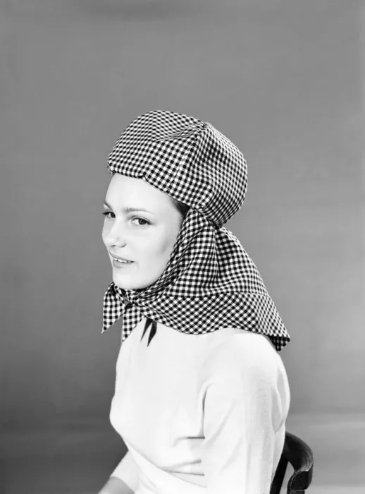 Framed Print : Model wearing hat that can be converted into a hooded cape. 1959 B1685-004 Framed Print : Model wearing hat that can be converted into a hooded cape. 1959 B1685-004