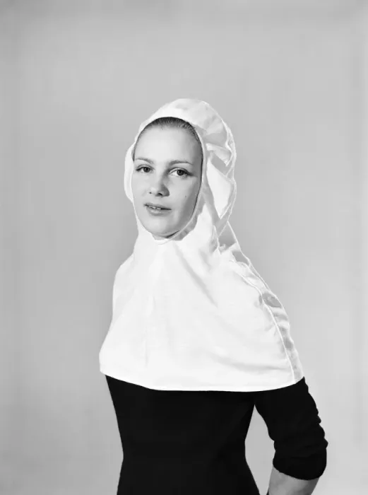 Framed Print : Model wearing hat that can be converted into a hooded cape. 1959 B1685-004 Framed Print : Model wearing hat that can be converted into a hooded cape. 1959 B1685-004