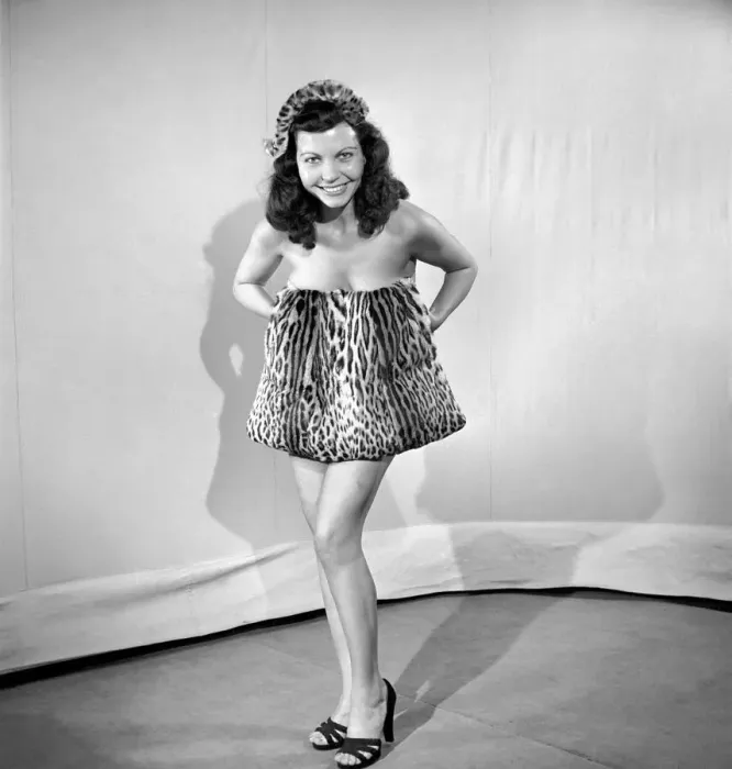 Framed Print : Model wearing leopard skin mini dress and matching muff. 1964 Framed Print : Model wearing leopard skin mini dress and matching muff. 1964