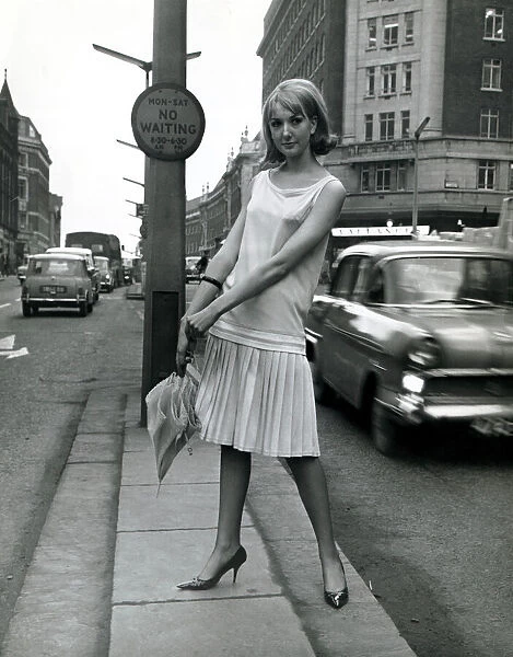 A model wearing Mary Quant Good Girl fashions for spring 1964 in London