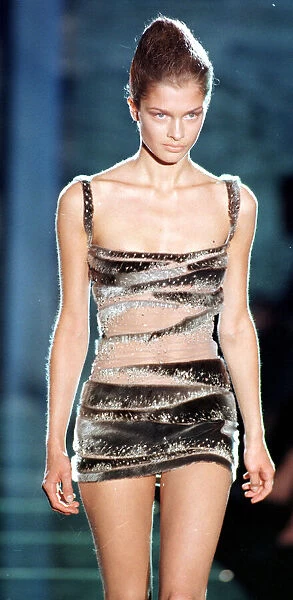 Model wearing a sparkling seal skin dress as part of Donatella Versace