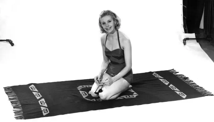 Framed Print : Model wearing a swimsuit kneeling on a towel. April 1961 P008824 Framed Print : Model wearing a swimsuit kneeling on a towel. April 1961 P008824