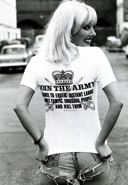 A model wearing a t-shirt with a controversial slogan in a London street August 1976