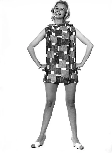 Model Wendy Tripp wearing sleeveless patterned mini dress