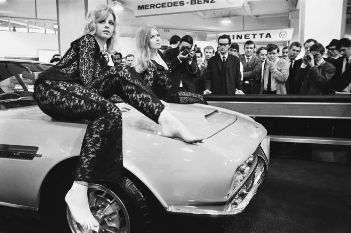 Framed Print : Models drapped over the bonnet of an Aston Martin DBS V8 at the 1969 Motor Show 1st June Framed Print : Models drapped over the bonnet of an Aston Martin DBS V8 at the 1969 Motor Show 1st June