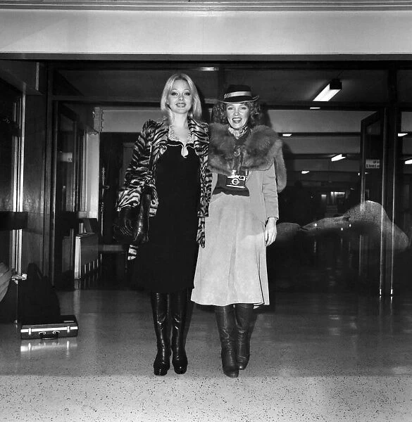 Models Lilian Muller (blonde) and Suze (in hat) leaving Heathrow Airport for Chicago