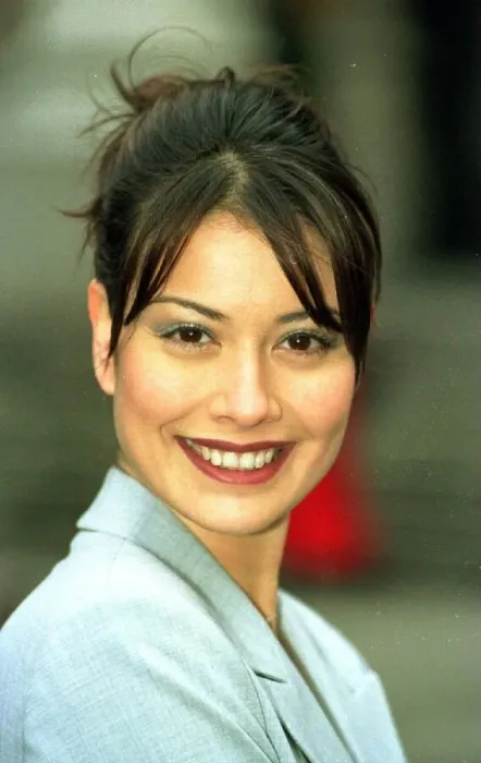 Framed Print : Models Melanie Sykes wears a lycra grey suit from Marks