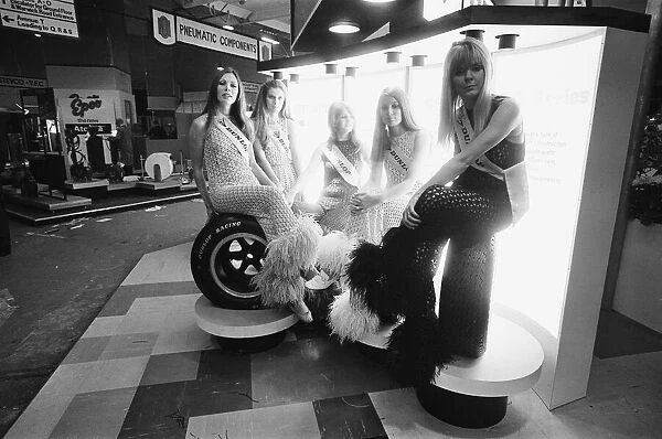 Models pose on the Dunlop stand at the Motor Show 15th October 1968