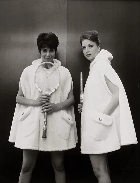 Models Sandra Russell (left) and Judy Wilson showing a zip-up hooded cape in fur fabric
